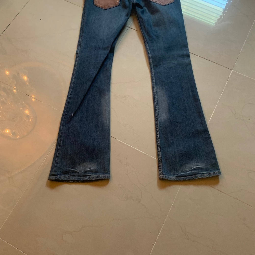 Blue jeans with leather accents